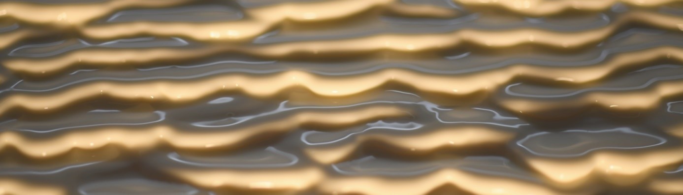 Apparition d’onde de surface lorsqu’une suspension de maïzena s’écoule sur un plan incliné.  © Darbois et al.